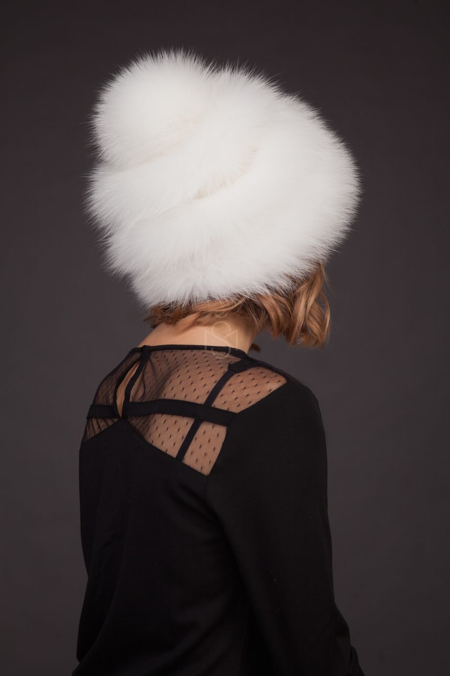 Fox fur hat with pom-pom and leather inserts, natural white color, made by SILTA MADA fur studio in Vilnius